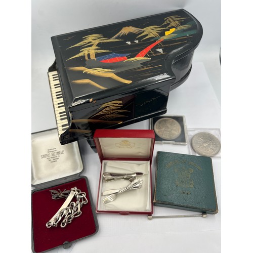 1350 - A miscellaneous lot to include grand piano black lacquer music box, crowns, silver identity bracelet... 