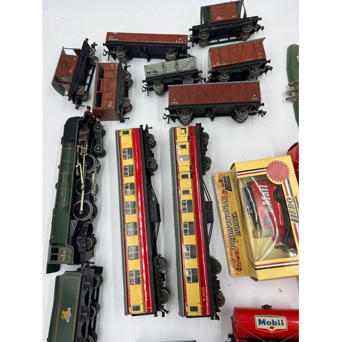 1204 - A quantity of vintage train carriages, engine, track etc to include Hornby Dublo, LLedo etc.