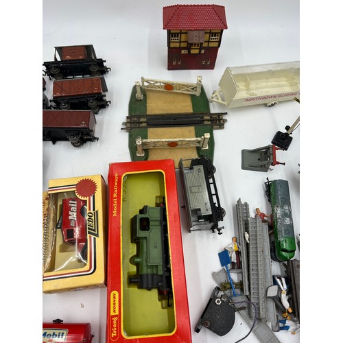 1204 - A quantity of vintage train carriages, engine, track etc to include Hornby Dublo, LLedo etc.