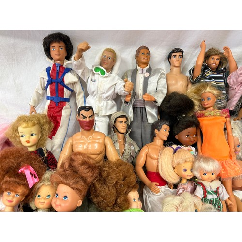 1201 - A mixed collection comprising of Barbies, Ken's and GI Joe along with some original Barbie clothes a... 