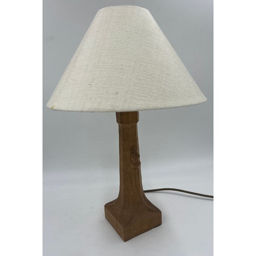 72 - Robert 'Mouseman' Thompson. An English oak table lamp with an octagonal column on a square base with... 