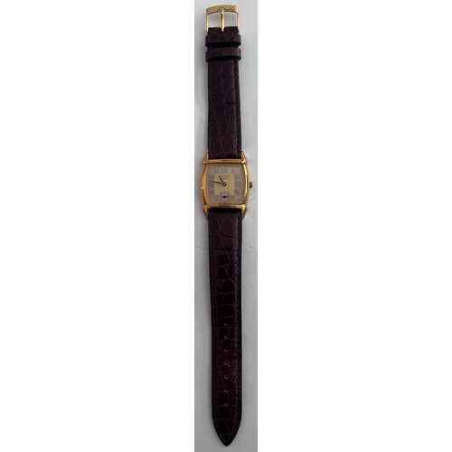 772 - A Bulova two tone dial art deco quartz wristwatch on brown leather strap. In red box.