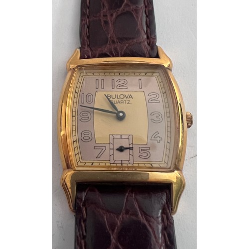 772 - A Bulova two tone dial art deco quartz wristwatch on brown leather strap. In red box.