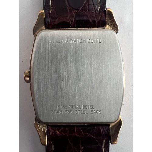 772 - A Bulova two tone dial art deco quartz wristwatch on brown leather strap. In red box.