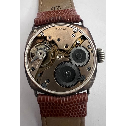 770 - A 1910'a gentleman's silver cased wristwatch on brown leather strap and subsidiary seconds dial with... 