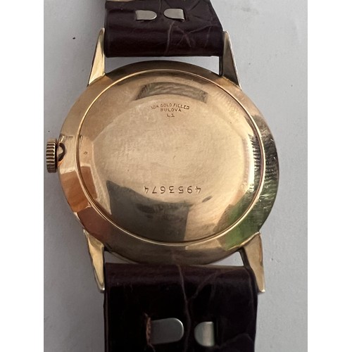 767 - A Bulova 1951 gentleman's wristwatch, 10k gold filled with red second hand on alligator calf strap i... 