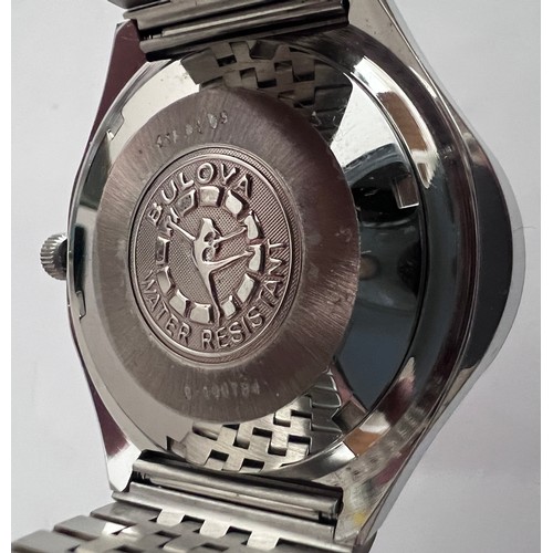 766 - A vintage Bulova wristwatch of unusual oval shape, silver and diamond dial on stainless steel bracel... 