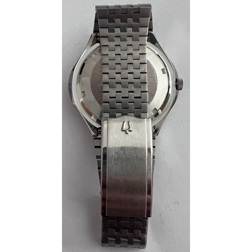 766 - A vintage Bulova wristwatch of unusual oval shape, silver and diamond dial on stainless steel bracel... 