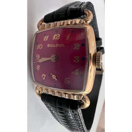 761 - A 1952 gold plated manual dark red Bulova enamelled dial. With guarantee and Bulova case. 

Good wor... 