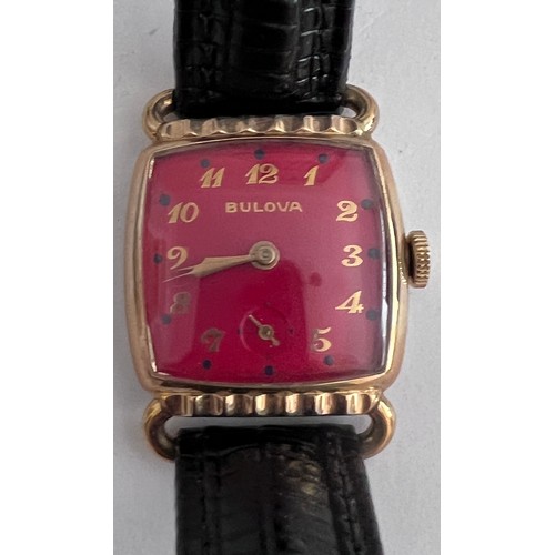 761 - A 1952 gold plated manual dark red Bulova enamelled dial. With guarantee and Bulova case. 

Good wor... 