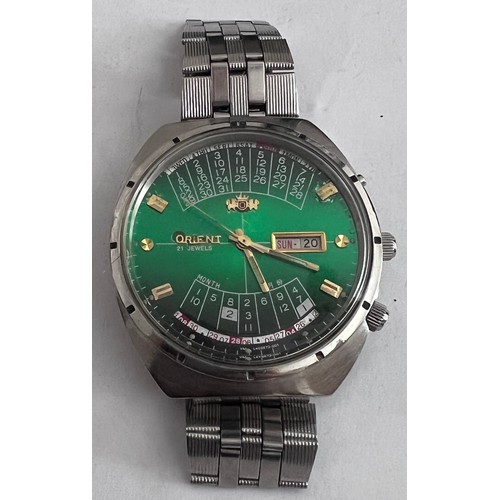 778 - An Orient perpetual calendar automatic steel wristwatch with green gradient dial. Case numbered Y469... 