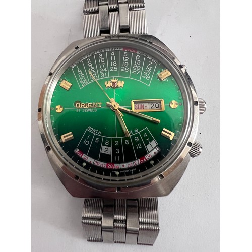 778 - An Orient perpetual calendar automatic steel wristwatch with green gradient dial. Case numbered Y469... 