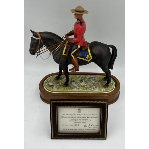 97 - A Royal Worcester limited edition model of a Royal Canadian Mounted Policeman modelled by Doris Lind... 