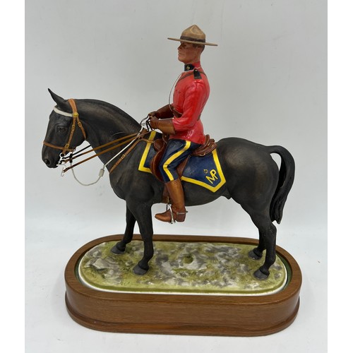 97 - A Royal Worcester limited edition model of a Royal Canadian Mounted Policeman modelled by Doris Lind... 