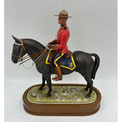 97 - A Royal Worcester limited edition model of a Royal Canadian Mounted Policeman modelled by Doris Lind... 