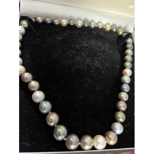 689 - A Tahiti and south sea pearl necklace of natural colour. 42 pearls in total. 18 carat white gold bal... 