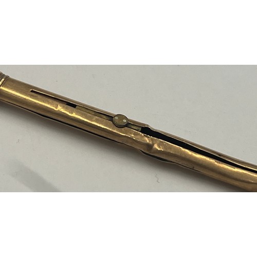 687 - A 9 carat gold Asprey retractable pencil on suspension ring. Length 7cm.  Total weight 4.3gm. Marked... 