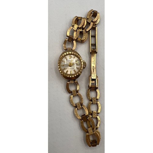 775 - A 9 carat  gold cased Regency ladies wristwatch with a 9 carat gold chain bracelet. Total weight 10.... 