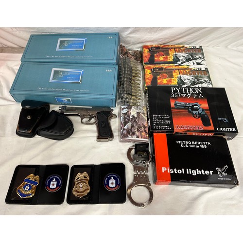 1358 - Various lighters in the form of guns, boxed together with handcuffs and keys, one pair Star, CIA & F... 