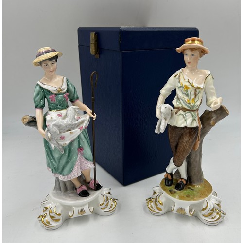 90 - Two Royal Crown Derby figures of shepherdess with lambs and detachable metal crook. Signed Joan Lee.... 