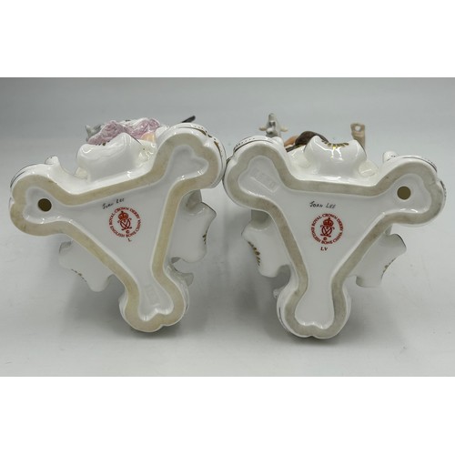 90 - Two Royal Crown Derby figures of shepherdess with lambs and detachable metal crook. Signed Joan Lee.... 