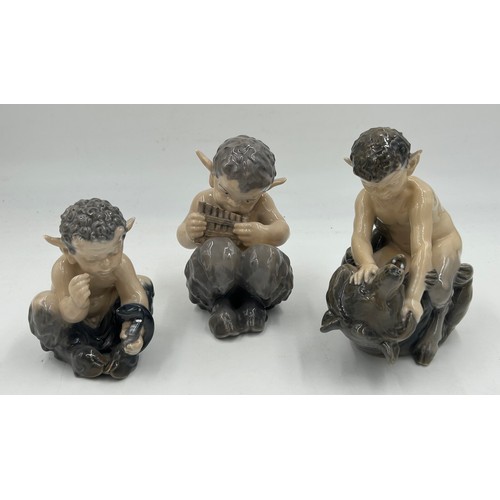 91 - Three Royal Copenhagen figures of fawns, one fighting a bear, 648, one with snake 1742 and one playi... 