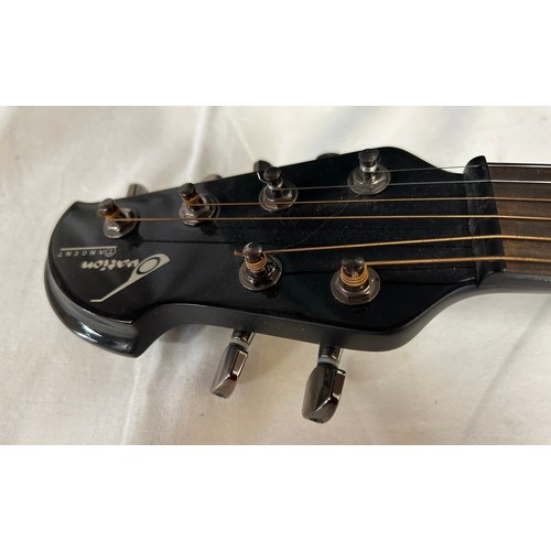 An Ovation Tangent T-257 electric guitar with an Ovation guitar case.