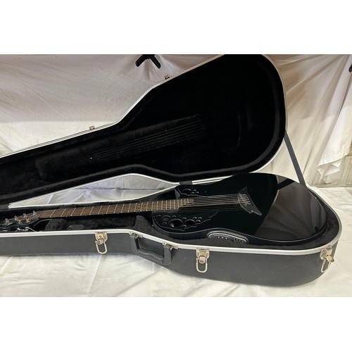 An Ovation Tangent T-257 electric guitar with an Ovation guitar case.