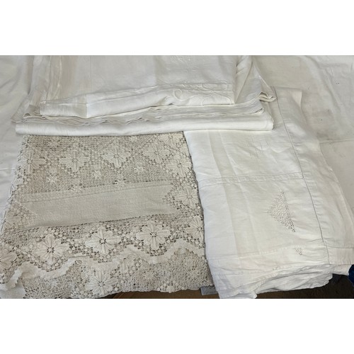 722 - A crocheted linen double bedcover, a double linen sheet and a large linen tablecloth.