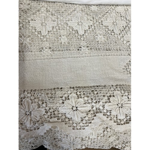 722 - A crocheted linen double bedcover, a double linen sheet and a large linen tablecloth.