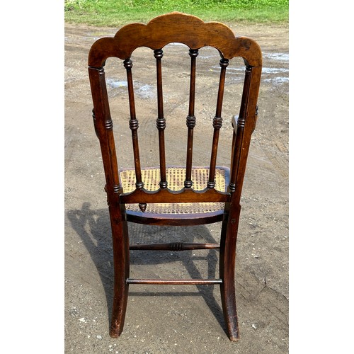 62 - A 19thC cane seated armchair with front cabriole legs and scroll arms. 108cm to back, 43cm to seat.