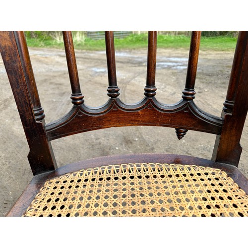 62 - A 19thC cane seated armchair with front cabriole legs and scroll arms. 108cm to back, 43cm to seat.