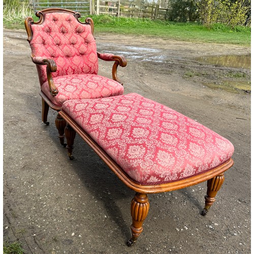 63 - An upholstered armchair with turned reeded legs and brass castors together with abutting footstool t... 