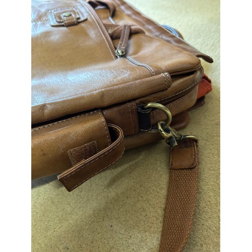 726 - A Rowallan brown leather laptop case with multiple zipped pockets and padded laptop cover, along wit... 