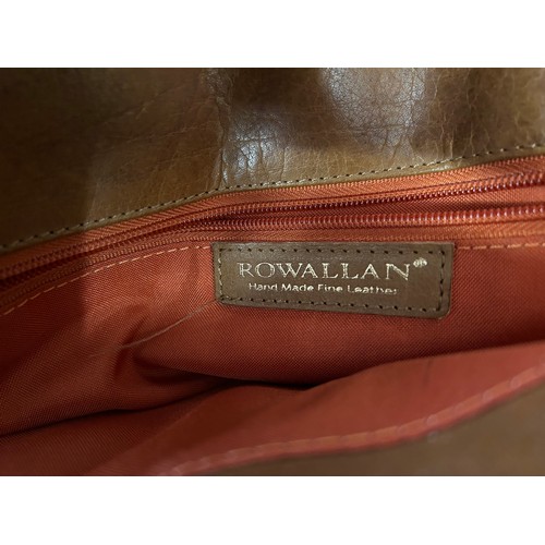 726 - A Rowallan brown leather laptop case with multiple zipped pockets and padded laptop cover, along wit... 