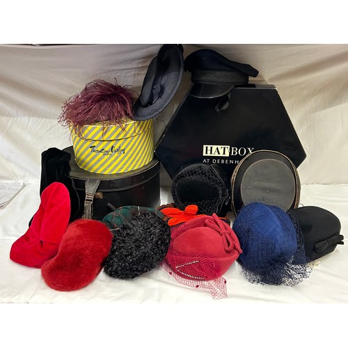 730 - A collection of various hats to include a collapsible opera top hat, a silk pleated lilac hat with a... 