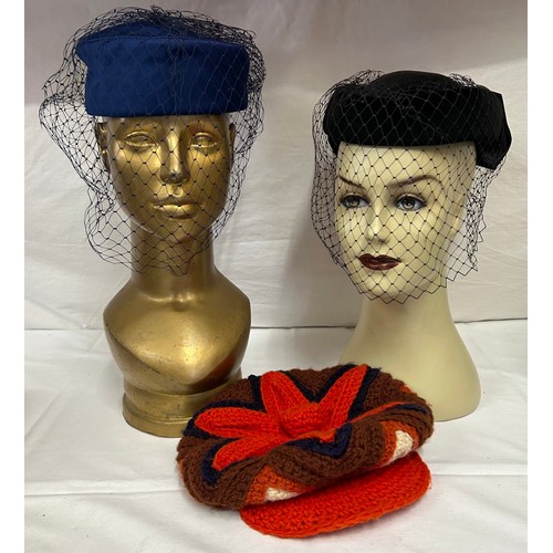 730 - A collection of various hats to include a collapsible opera top hat, a silk pleated lilac hat with a... 