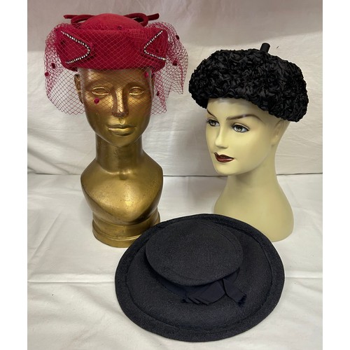 730 - A collection of various hats to include a collapsible opera top hat, a silk pleated lilac hat with a... 