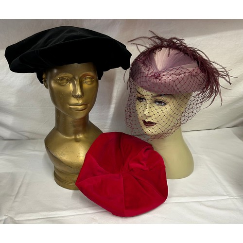 730 - A collection of various hats to include a collapsible opera top hat, a silk pleated lilac hat with a... 