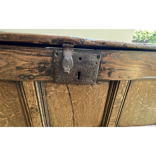 55 - A 17thC oak coffer with iron lock and snipe hinges. 98cm w x 36cm d x 52cm h.