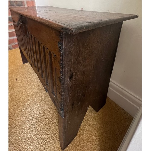 56 - A 17thC oak six plank coffer with linen fold decoration to front. Iron lock. Replacement hinges. 69c... 