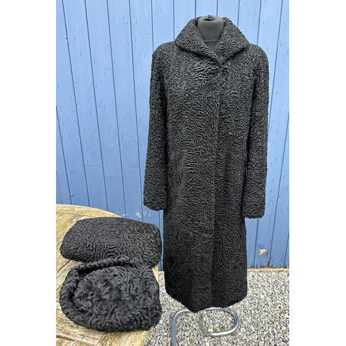 738 - Various items to include a lined curly lambs wool coat along matching bag/muff and hat. Coat measure... 