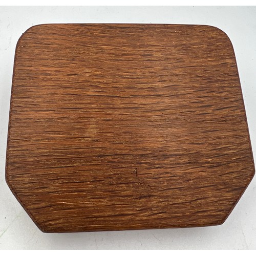 69A - A Peter Heap ‘Rabbitman’ oak ashtray. 10cm x 8.5cm. Marked to underside N with tree.