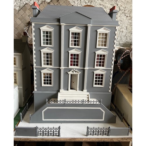 1109 - A large modern dolls house and extensive contents. 112cm h x 98cm w x 78 d.