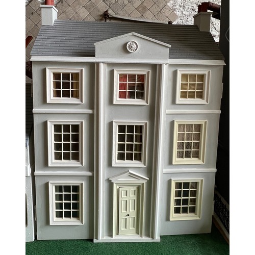 1113 - A modern dolls house, 61cm w x 83cm h x 31cm w together with bakers shop, music room, shop with acco... 