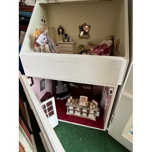 1113 - A modern dolls house, 61cm w x 83cm h x 31cm w together with bakers shop, music room, shop with acco... 