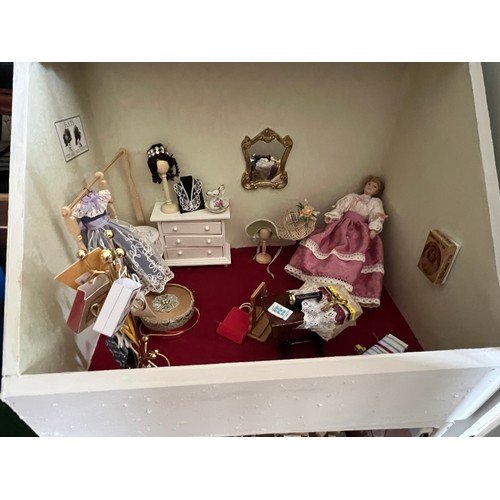 1113 - A modern dolls house, 61cm w x 83cm h x 31cm w together with bakers shop, music room, shop with acco... 