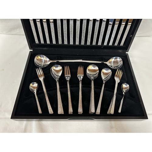 1365 - A Viners 8 piece canteen of cutlery by Gerald Benney, missing 1 teaspoon and 1 dessert fork (56).