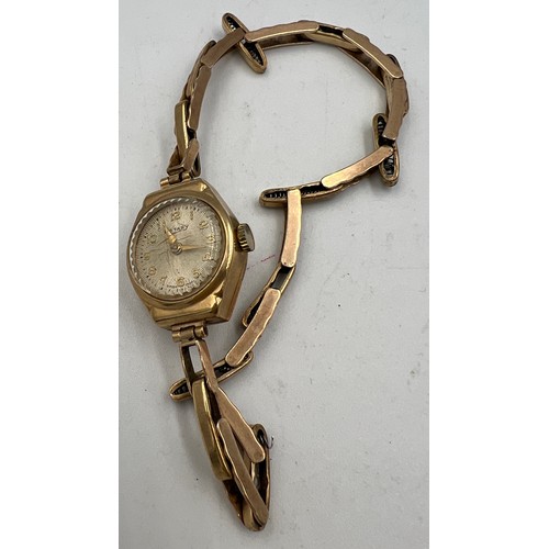 830 - A 9 carat gold ladies Rotary wristwatch with 9 carat gold expanding bracelet. Total weight 13.6gm.