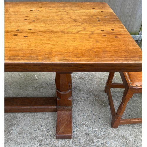 66 - A Robert Thompson ‘Mouseman’ adzed oak dining table and six chairs given by Robert Thompson to his d... 